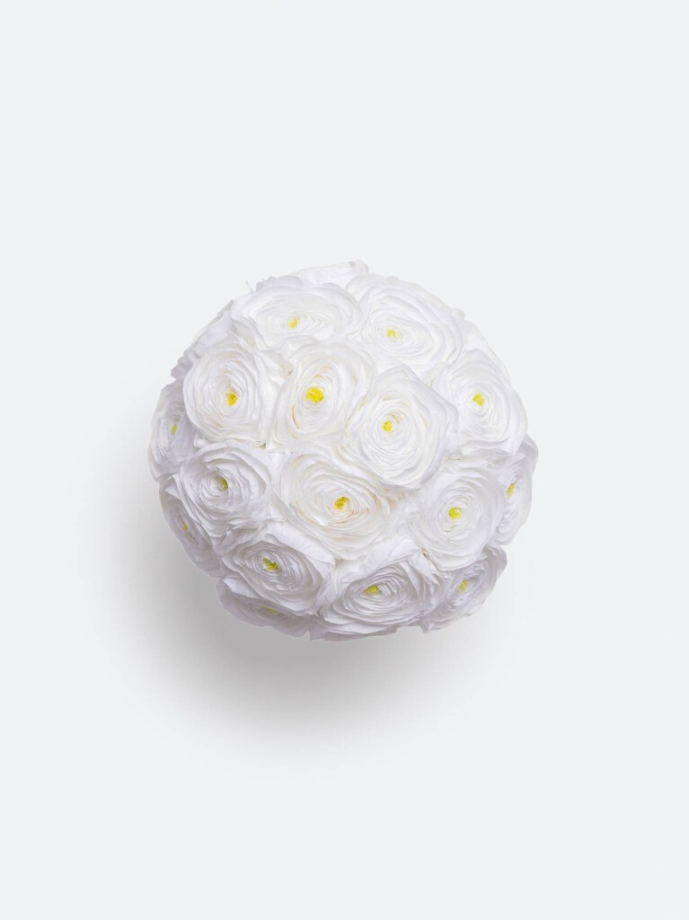 A perfectly spherical overhead view reveals tightly packed layers of snow-white petals with golden-yellow hearts, forming a flawless cloud-like bouquet with symmetrical precision.